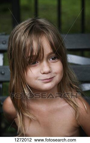 Girl looking away and smiling, close-up View Large Photo Image Stock Image - Girl looking away and smiling, close-up. Fotosearch