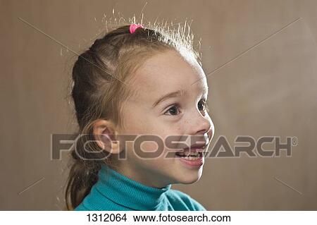 Picture - Girl looking away, close-up. Fotosearch