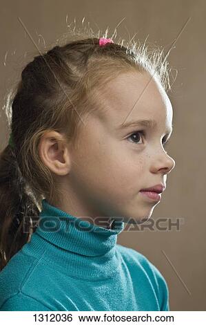 Stock Photograph - Girl looking away, close-up. Fotosearch