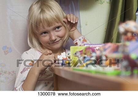 Girl playing with toys View Large Photo Image Stock Photo - Girl playing with toys. Fotosearch