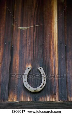 Good luck horseshoe on wood View Large Photo Image Stock Photo - Good luck horseshoe on wood. Fotosearch