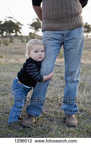 Grandfather with grandson, looking at camera View Large Photo Image Stock Image - Grandfather with grandson, looking at camera. Fotosearch