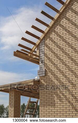 House with wooden roof under construction View Large Photo Image Picture - House with wooden roof under construction. Fotosearch