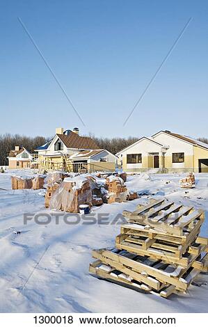 Houses with stack of crates on snow View Large Photo Image Stock Photo - Houses with stack of crates on snow. Fotosearch
