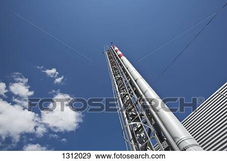 Low angle view of distillation tower View Large Photo Image Stock Photo - Low angle view of distillation tower. Fotosearch