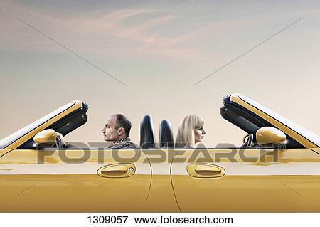 Man and woman driving car View Large Photo Image Stock Photo - Man and woman driving car. Fotosearch