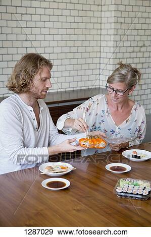 Stock Photo - Man and woman having lunch. Fotosearch