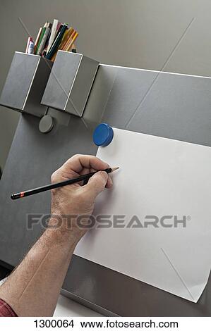 Man drawing on paper View Large Photo Image Picture - Man drawing on paper. Fotosearch