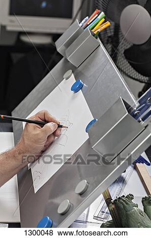Man drawing on paper View Large Photo Image Stock Photo - Man drawing on paper. Fotosearch