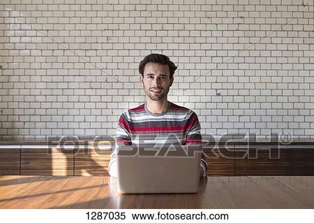 Man using laptop, portrait View Large Photo Image Stock Photography - Man using laptop, portrait. Fotosearch