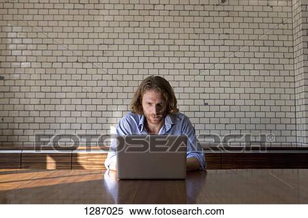 Man using laptop View Large Photo Image Stock Photography - Man using laptop. Fotosearch