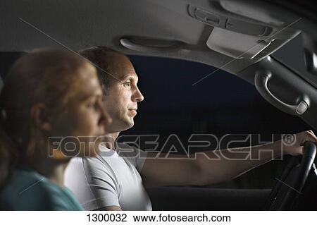 Mid adult couple in car View Large Photo Image Stock Image - Mid adult couple in car. Fotosearch