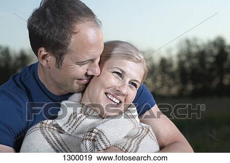 Mid adult couple smiling, close-up View Large Photo Image Stock Photo - Mid adult couple smiling, close-up. Fotosearch