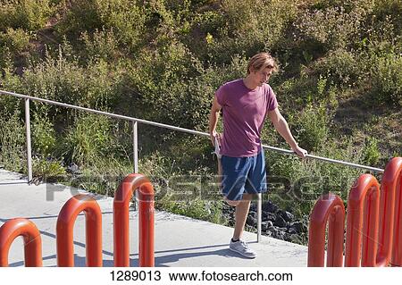 Mid adult man exercising View Large Photo Image Stock Image - Mid adult man exercising. Fotosearch