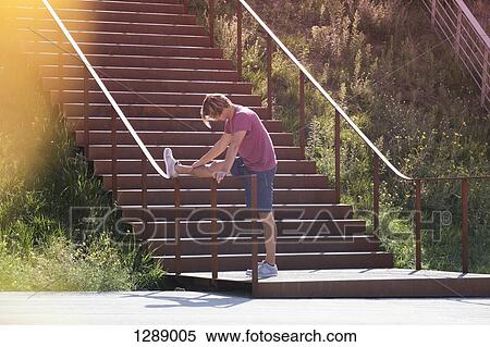 Mid adult man exercising View Large Photo Image Stock Photography - Mid adult man exercising. Fotosearch