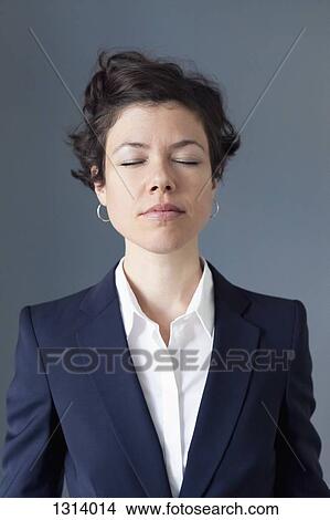 Mid adult woman with eyes closed, close-up View Large Photo Image Picture - Mid adult woman with eyes closed, close-up. Fotosearch