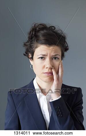 Mid adult woman with worried expression, close-up View Large Photo Image Stock Image - Mid adult woman with worried expression, close-up. Fotosearch