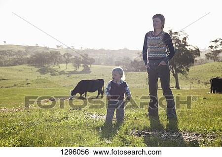 Stock Photograph - Mother with baby boy, looking away. Fotosearch