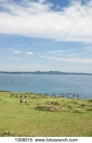 Mother with daughter and son at coastline, distant View Large Photo Image Stock Photography - Mother with daughter and son at coastline, distant. Fotosearch