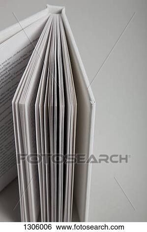 Stock Photograph - Open book on white background, close-up. Fotosearch