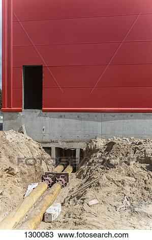 Pipe lines and building under construction View Large Photo Image Stock Image - Pipe lines and building under construction. Fotosearch