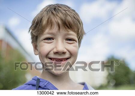 Portrait of boy smiling, close-up View Large Photo Image Stock Image - Portrait of boy smiling, close-up. Fotosearch
