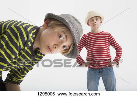 Portrait of boys against white background View Large Photo Image Stock Photograph - Portrait of boys against white background. Fotosearch