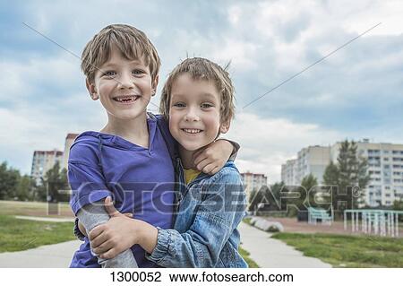 Stock Image - Portrait of boys smiling. Fotosearch