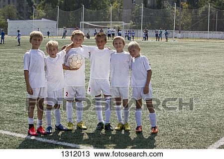 Portrait of boys standing on football pitch View Large Photo Image Stock Image - Portrait of boys standing on football pitch. Fotosearch