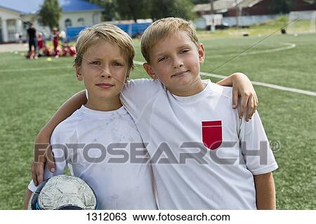 Portrait of boys with football View Large Photo Image Stock Image - Portrait of boys with football. Fotosearch