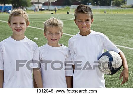 Portrait of boys with football View Large Photo Image Stock Photo - Portrait of boys with football. Fotosearch