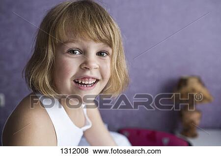 Stock Photo - Portrait of girl smiling, close-up. Fotosearch