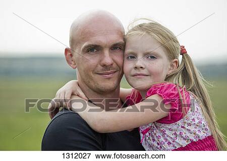 Portrait of girl with father, close-up View Large Photo Image Stock Photo - Portrait of girl with father, close-up. Fotosearch