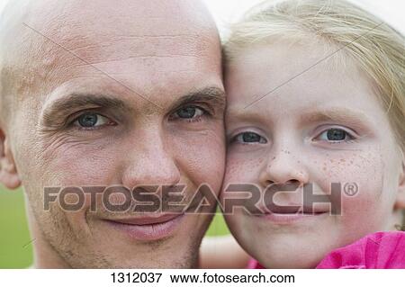 Stock Photo - Portrait of girl with father, close-up. Fotosearch