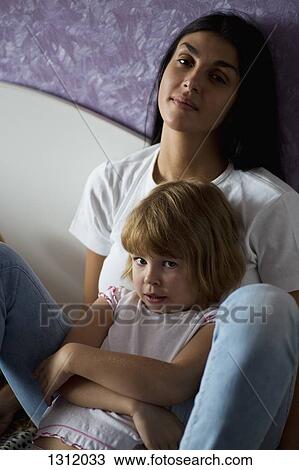 Stock Image - Portrait of girl with mother. Fotosearch