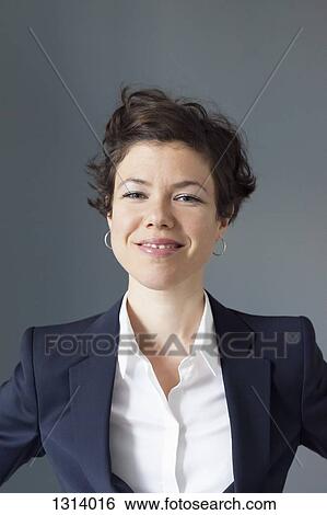 Portrait of mid adult woman smiling, close-up View Large Photo Image Stock Photograph - Portrait of mid adult woman smiling, close-up. Fotosearch