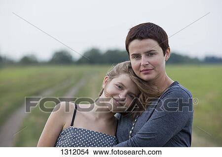 Picture - Portrait of mother and daughter, close-up. Fotosearch