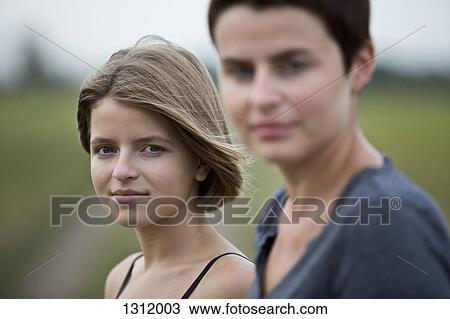 Portrait of mother and daughter, close-up View Large Photo Image Stock Image - Portrait of mother and daughter, close-up. Fotosearch