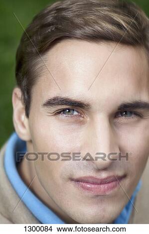 Portrait of young man, close-up View Large Photo Image Picture - Portrait of young man, close-up. Fotosearch