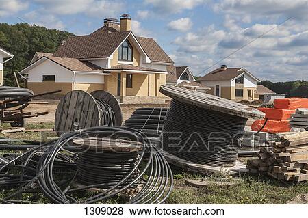 Reel of the cable wire on the construction site View Large Photo Image Stock Photo - Reel of the cable wire on the construction site. Fotosearch