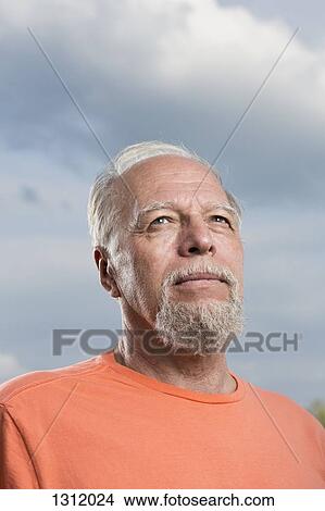Senior man looking up, close-up View Large Photo Image Picture - Senior man looking up, close-up. Fotosearch