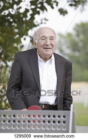 Senior man playing table tennis View Large Photo Image Stock Photo - Senior man playing table tennis. Fotosearch