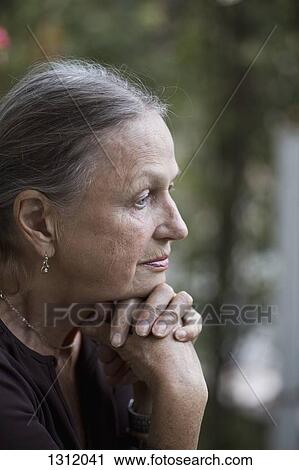 Stock Image - Senior woman looking away, close-up. Fotosearch