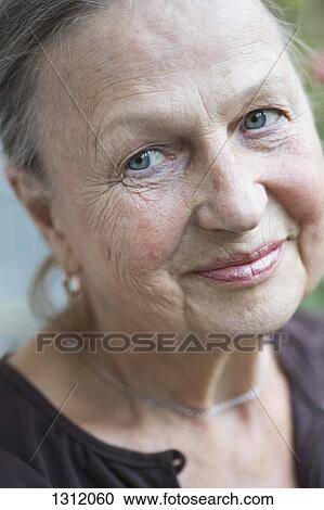Senior woman looking away, smiling View Large Photo Image Stock Image - Senior woman looking away, smiling. Fotosearch
