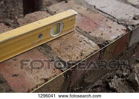 Spirit level on bricks, close-up View Large Photo Image Stock Image - Spirit level on bricks, close-up. Fotosearch