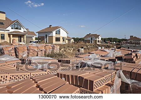 Stacks of hollow bricks at construction site View Large Photo Image Stock Image - Stacks of hollow bricks at construction site. Fotosearch