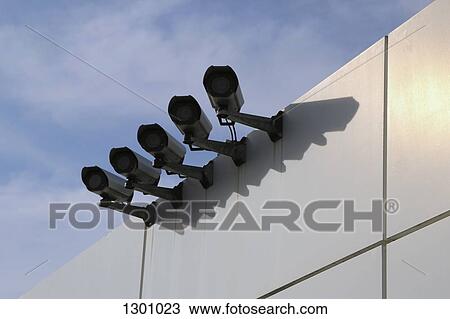 Surveillance cameras on wall, low angle view View Large Photo Image Stock Image - Surveillance cameras on wall, low angle view. Fotosearch