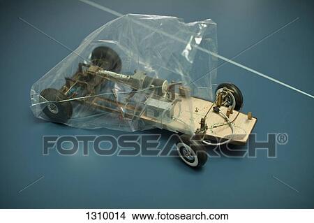 Picture - Toy car frame in plastic bag, close-up. Fotosearch