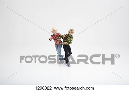 Two boys fighting against white background View Large Photo Image Stock Image - Two boys fighting against white background. Fotosearch