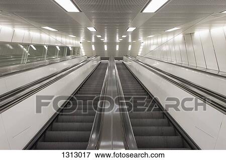 Two escalators side by side View Large Photo Image Stock Photo - Two escalators side by side. Fotosearch